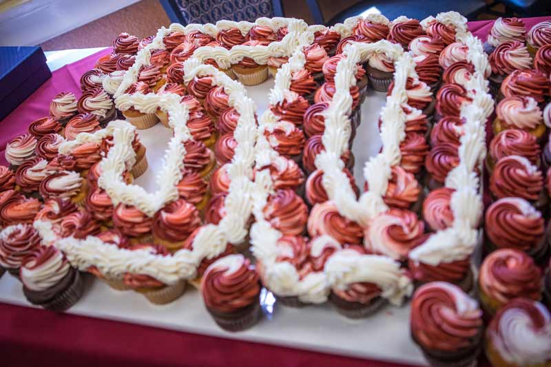 Cupcakes on a board that spell out "50" for 50 years of service.