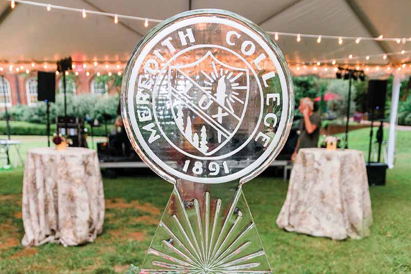 A glass sculpture of the Meredith emblem.