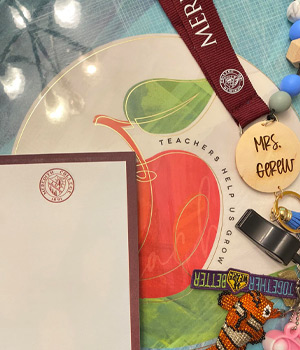 A notepad, lanyard, and some stickers for alumnae educators.