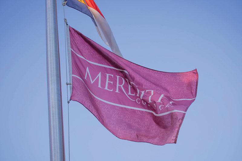 A Meredith flag waving in the wind.