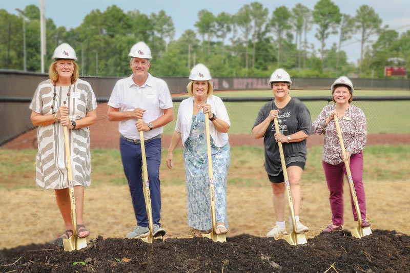 President Allen and other people break ground on the new athletic complex.
