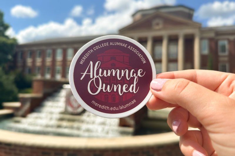 Alumnae owned business sticker in front of johnson hall.